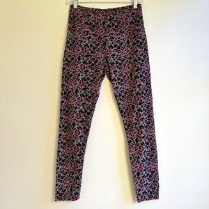 Leopard print leggings in gray, black, and pink